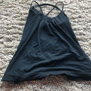 Black Lululemon tank with halter and cross cross straps and built in bra